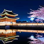 경복궁 야간개장 포토존 - **Prompt:** Illuminated Gyeongbokgung Palace at night, reflections in water, cherry blossom trees, s...